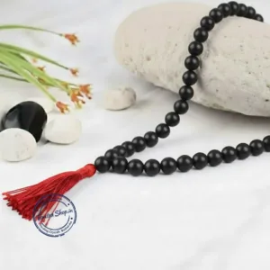 Close up natural shaligram mala sacred beads texture